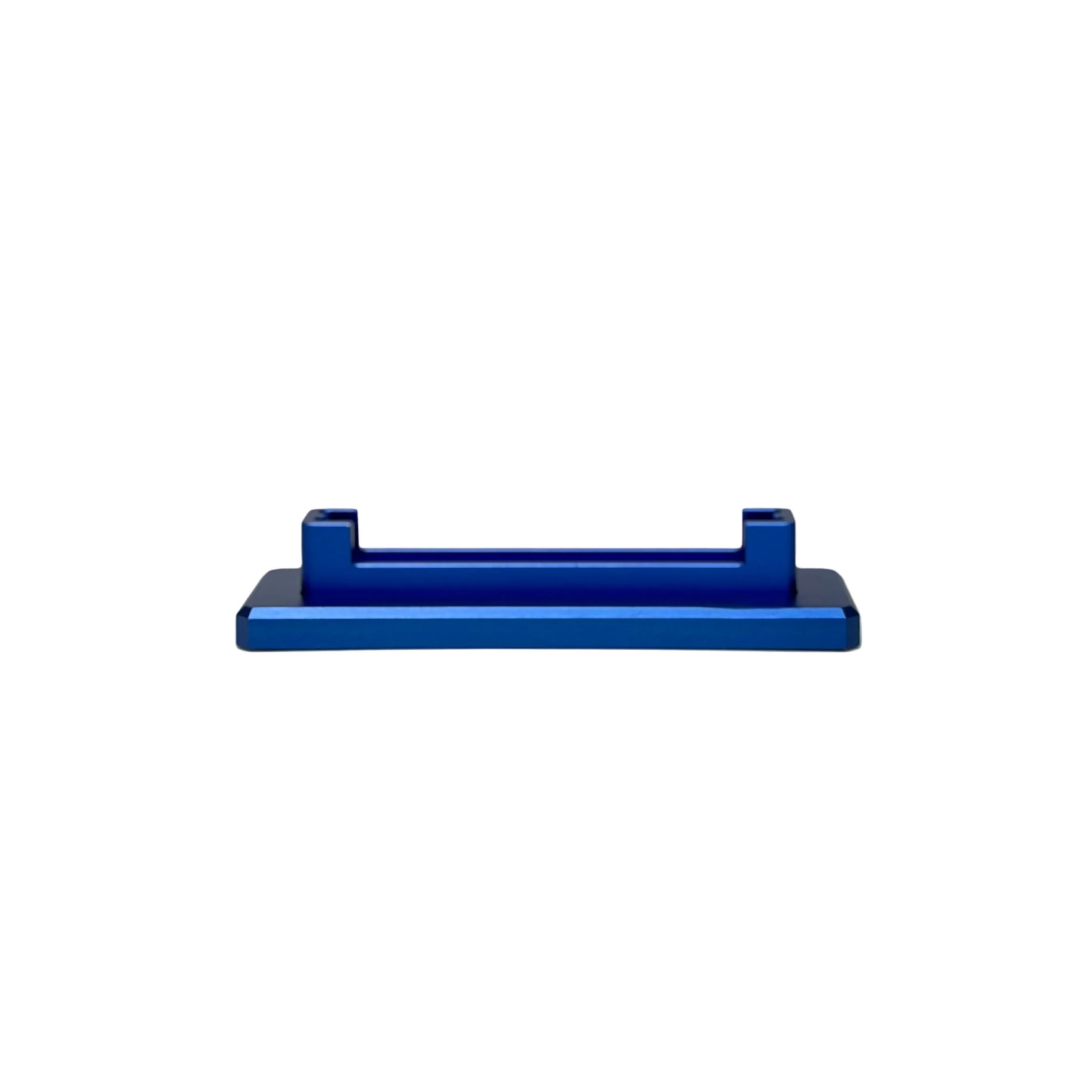 A small blue rectangular plastic or metal stand with two upright tabs, displayed on a round white pedestal against a light textured beige background.